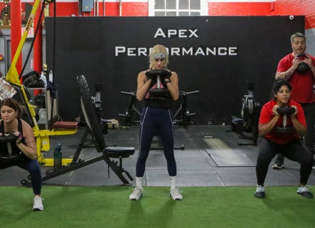 woman using resistance bands in a gym
