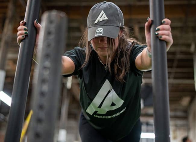 woman using resistance bands in a gym