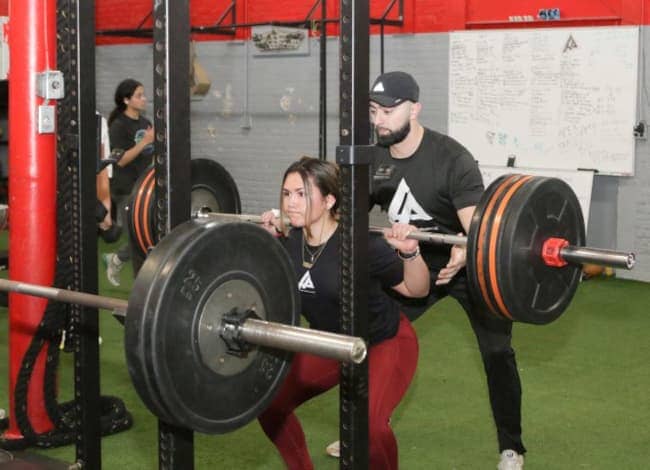 woman using resistance bands in a gym